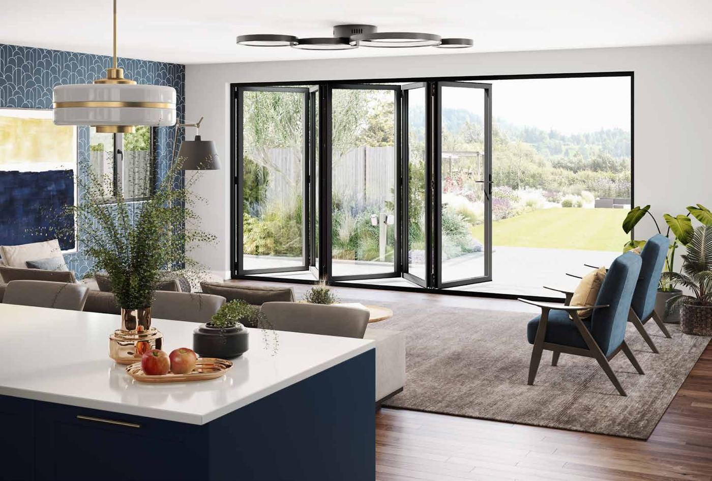 Kitchen opening onto the garden through glazed doors