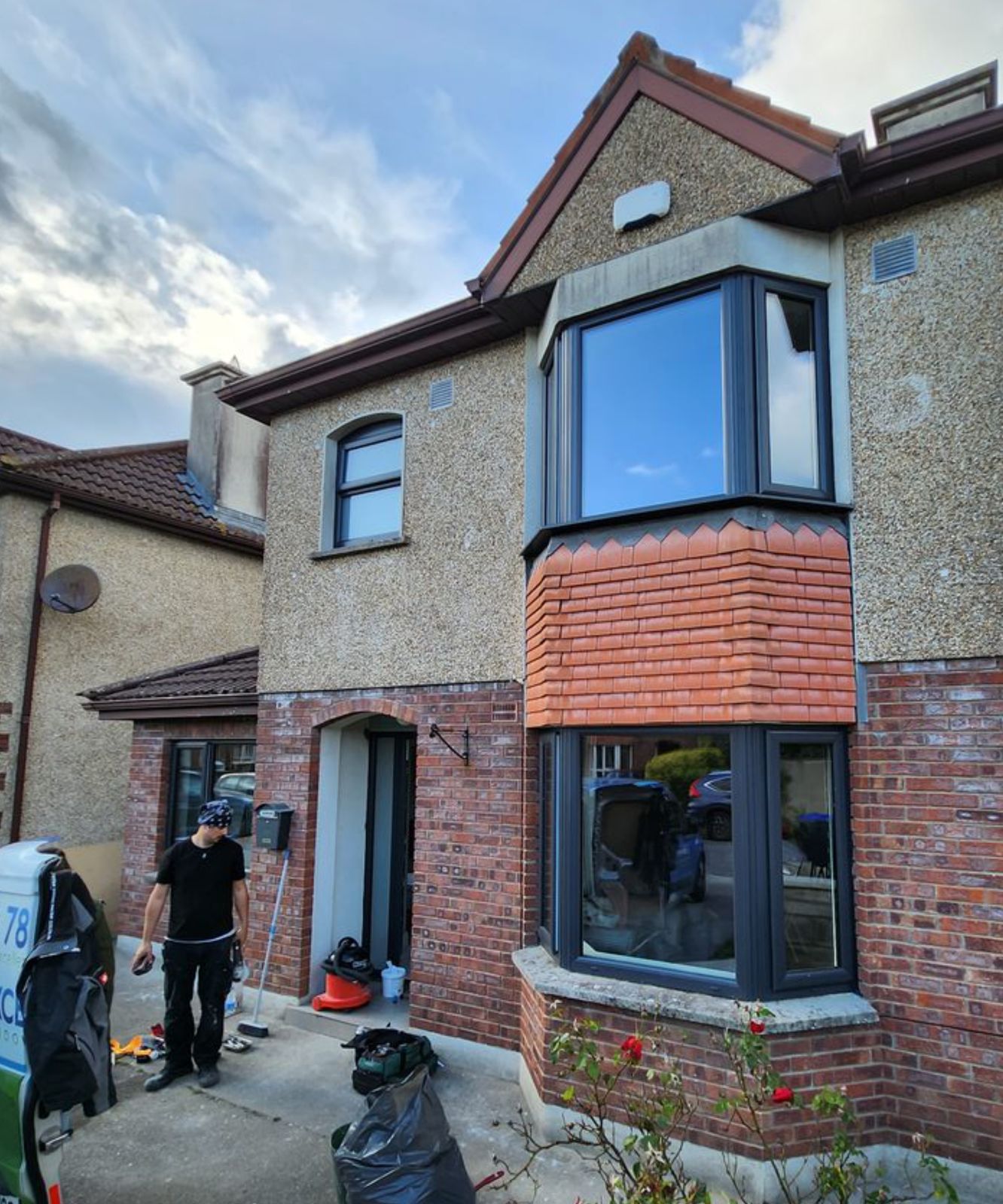 Anthracite bay windows on a two-storey house