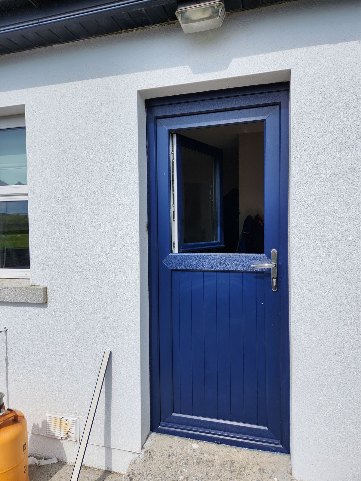 Blue stable door with opening top section