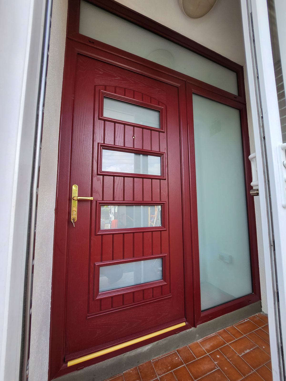 Red front door with frosted side panel