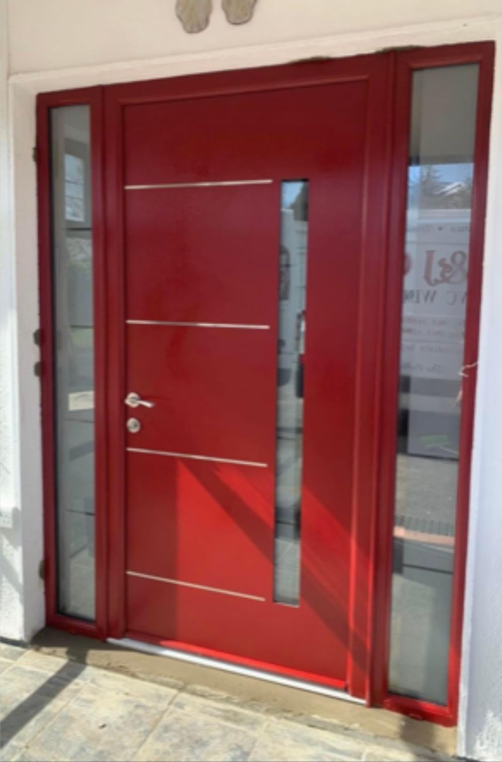 Red front door with two side panels