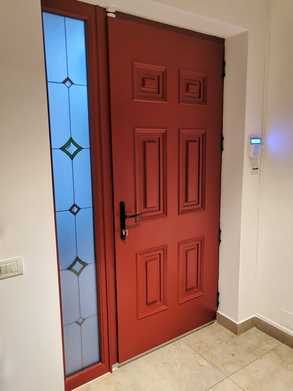 Red panelled door with leaded side panel, inside view