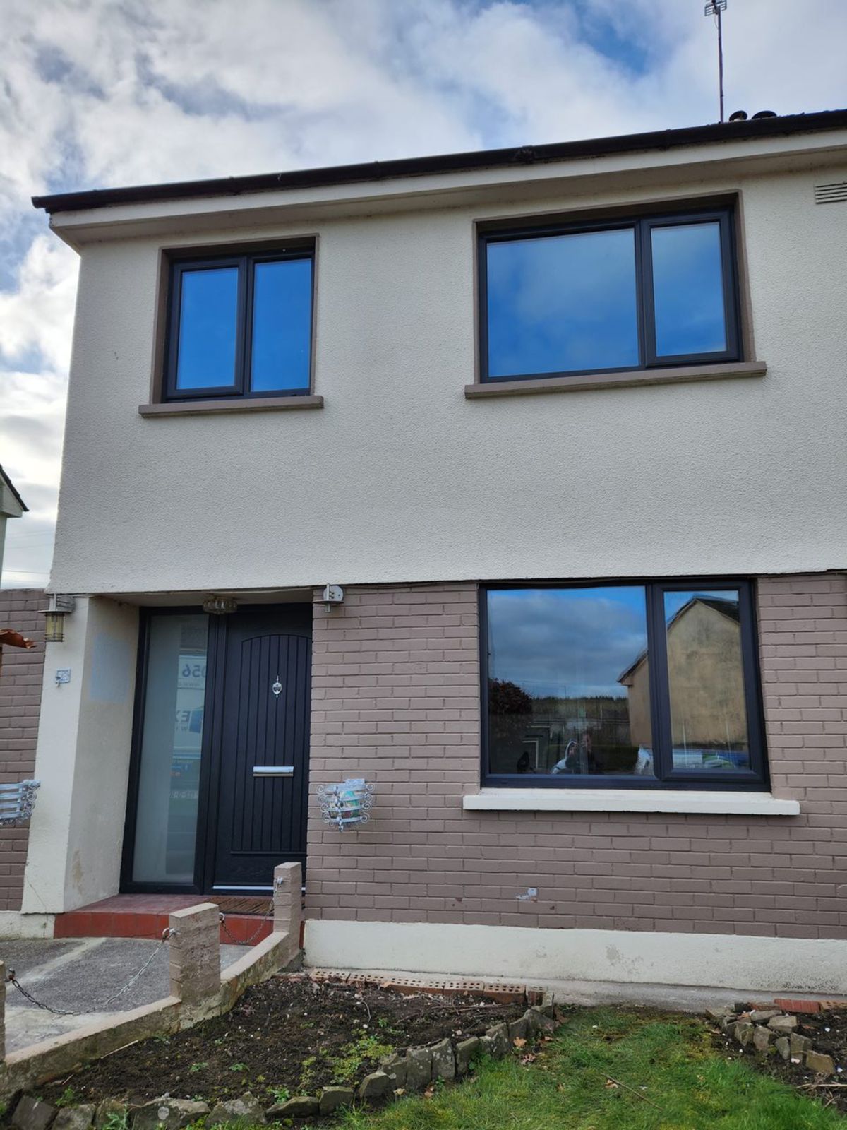 Anthracite windows and front door on a semi-detached house